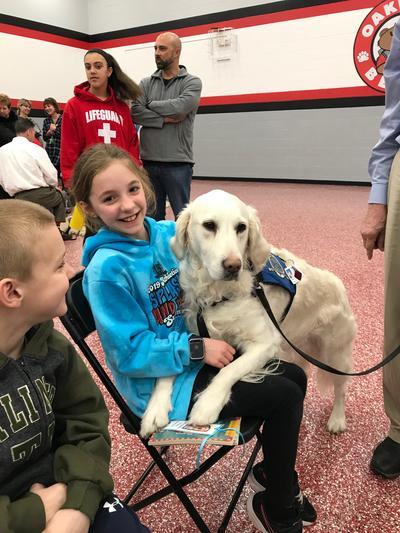 Kids with a service dog at Oakwood School Reading Night